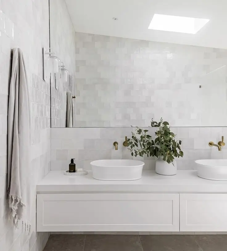 Modern bathroom renovation in Mosman with white vanity, vessel basins and gold tapware