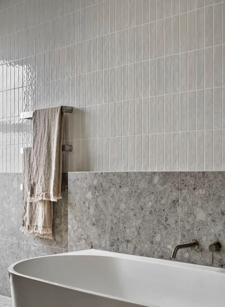 Sydney bathroom with walk-in shower, herringbone tile, and minimal modern renovation style
