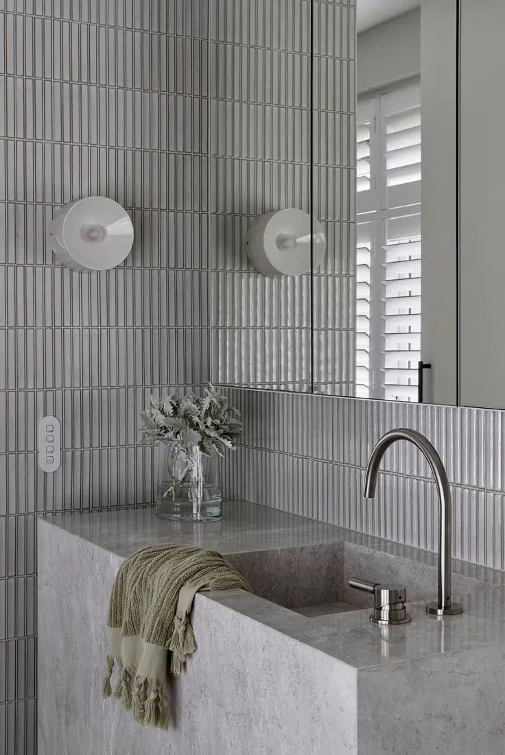 Modern Sydney bathroom with floating vanity, stone finishes, and sleek renovation design