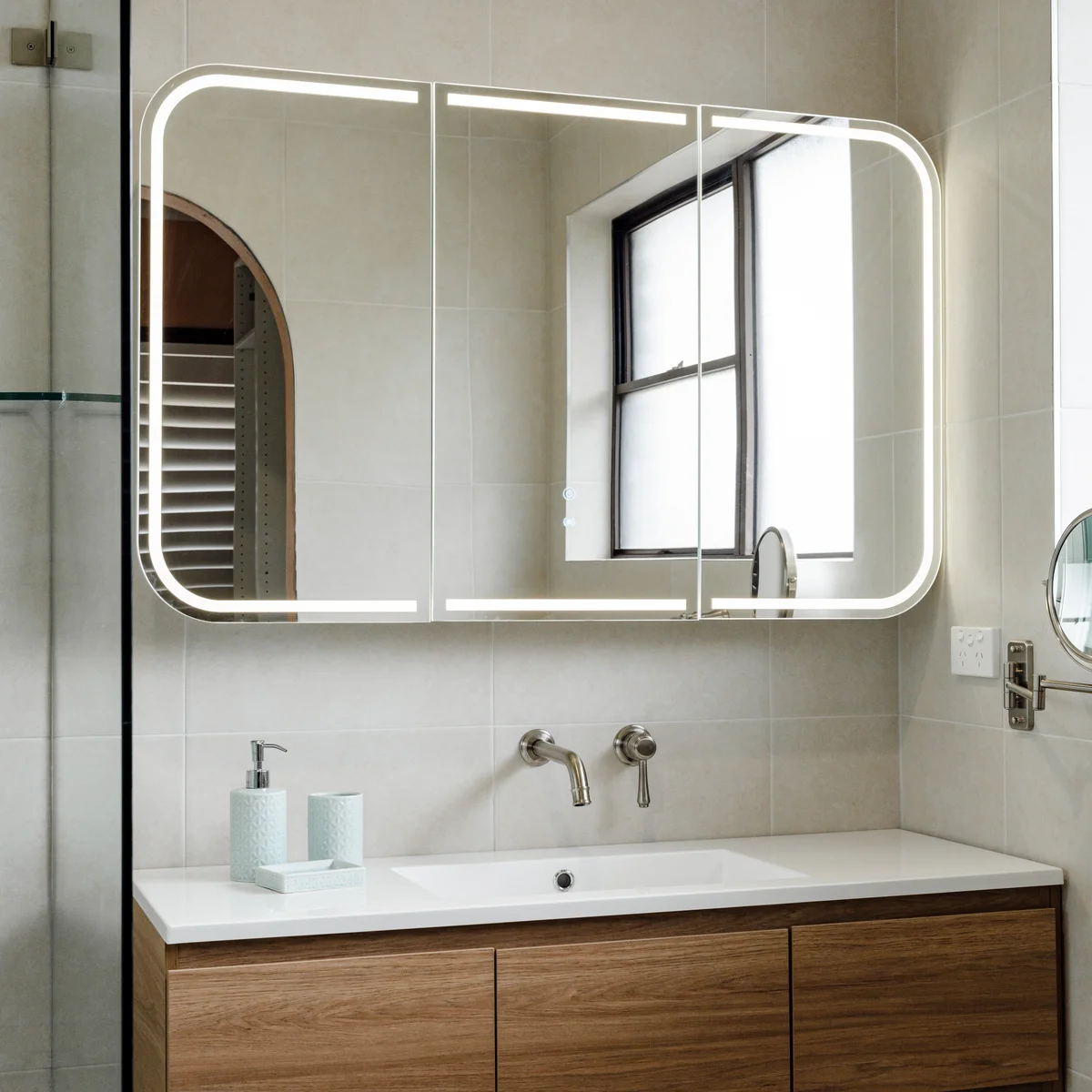 Timber vanity with LED mirror cabinet in a modern bathroom renovation