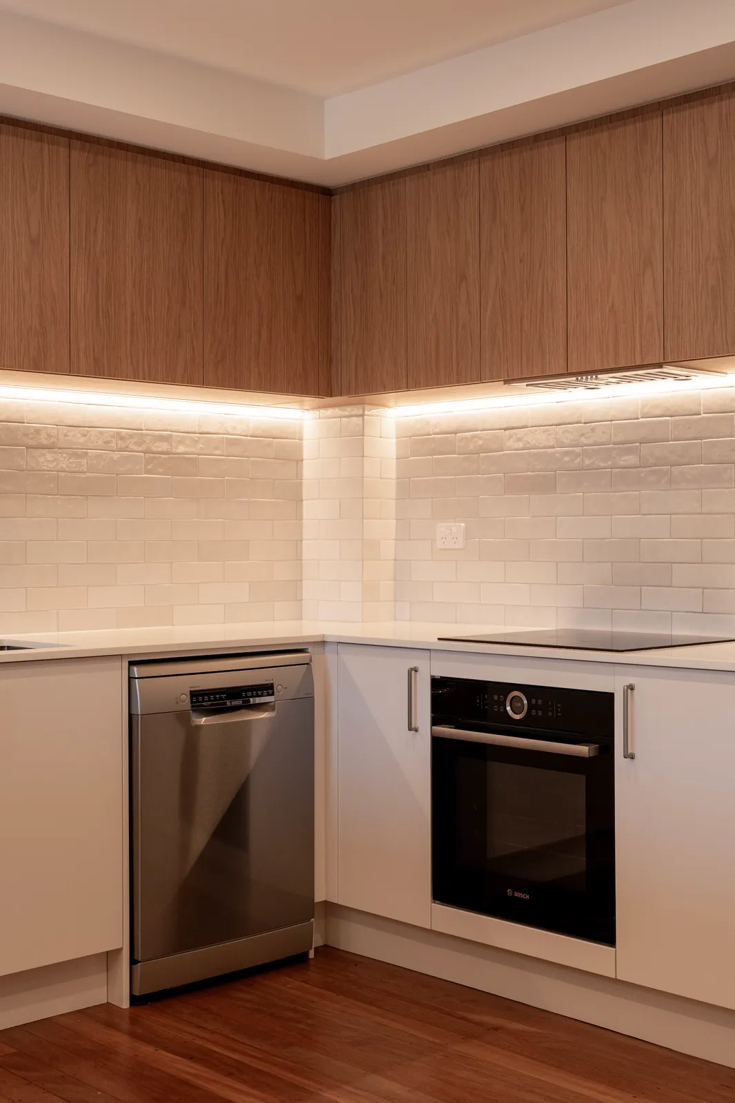 Kitchen detail showing under-cabinet strip lighting, splashback tiles and Bosch appliances
