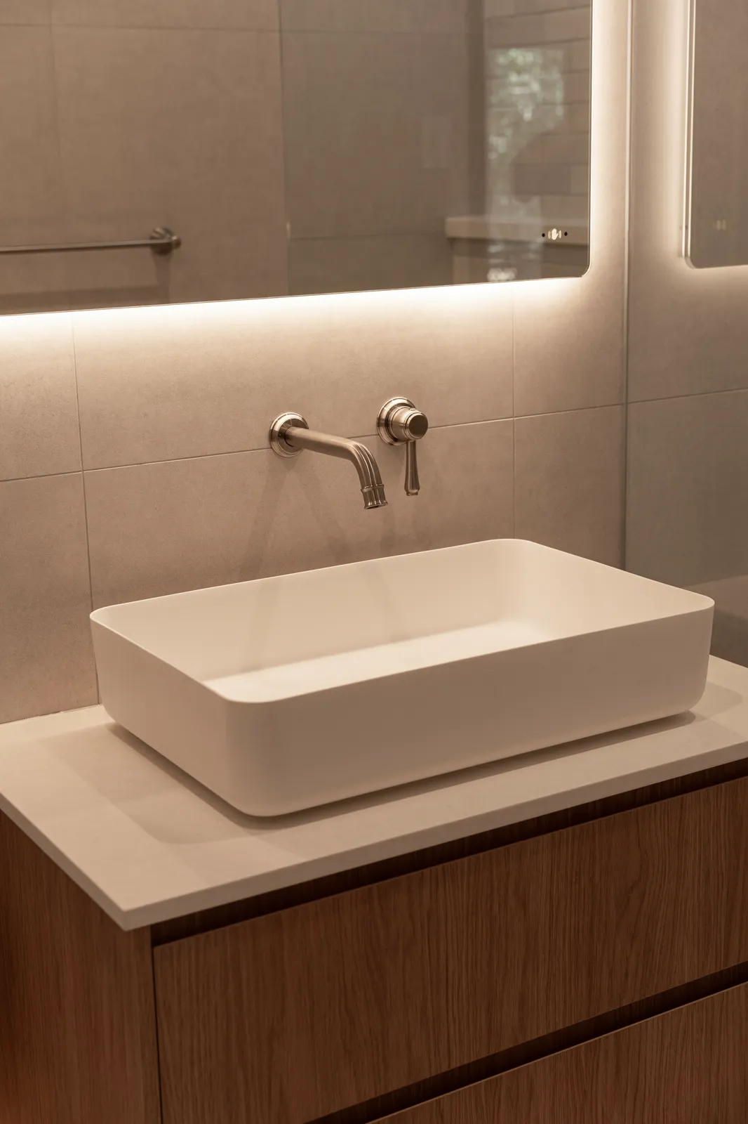 Kiva vessel basin on stone benchtop with ABI Kingsley wall-mounted brushed nickel tapware