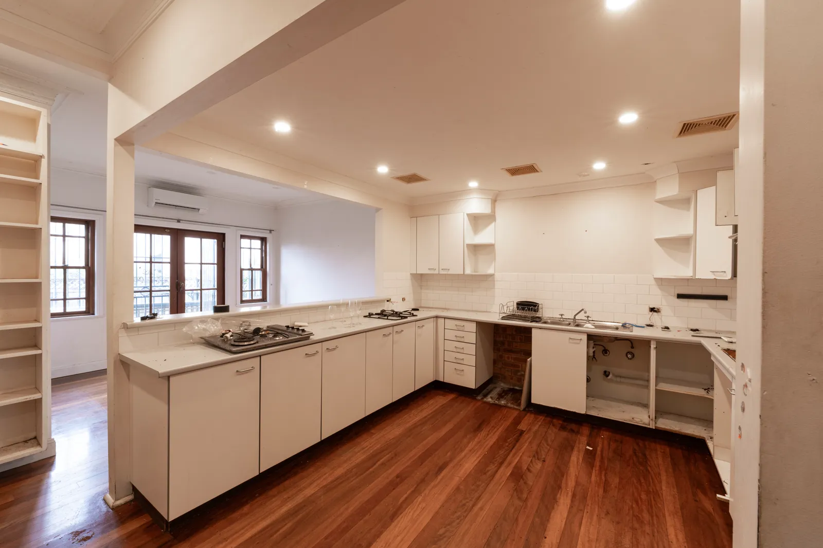 Original Alexandria kitchen before renovation with dated cabinetry and layout