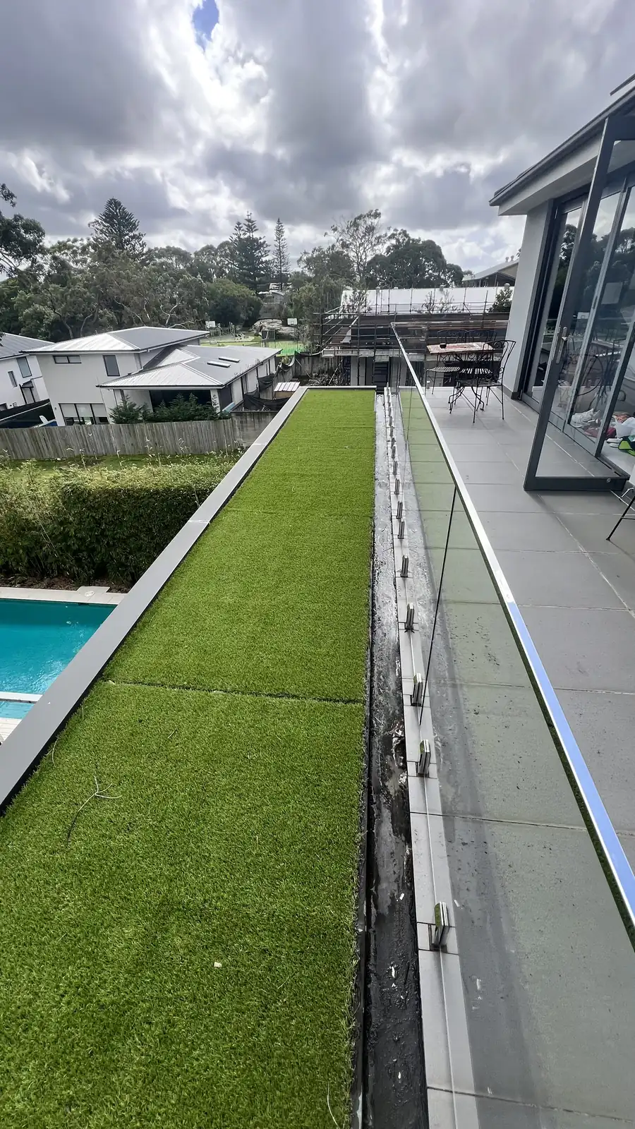 Original middle Balgowlah Heights balcony with old stainless steel wire balustrading and worn ceiling beneath