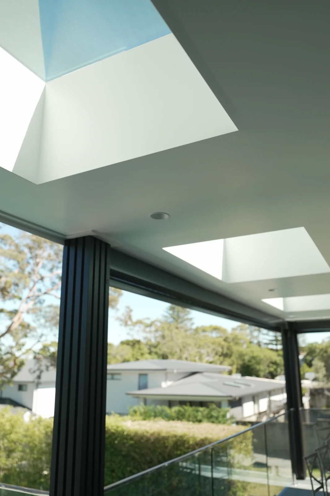 Three new VELUX FCM fixed skylights set into the Colorbond roof above the top balcony