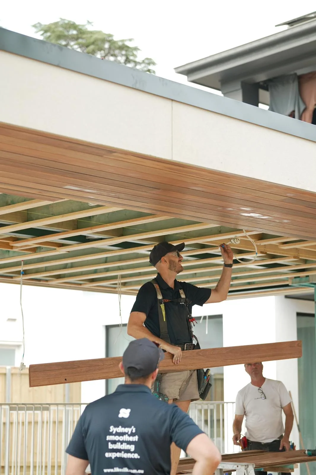The LikeSilk team installing the spotted gum ceiling lining to the cabana in Northbridge