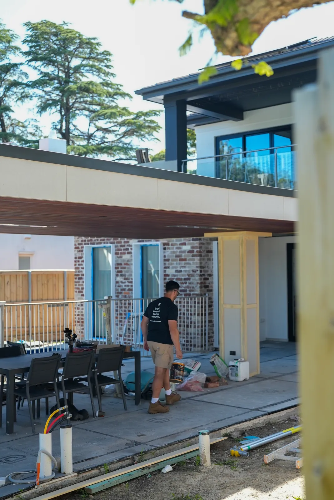 Cabana with spotted gum lined ceiling overlooking the new pool, paving and timber fencing in Northbridge