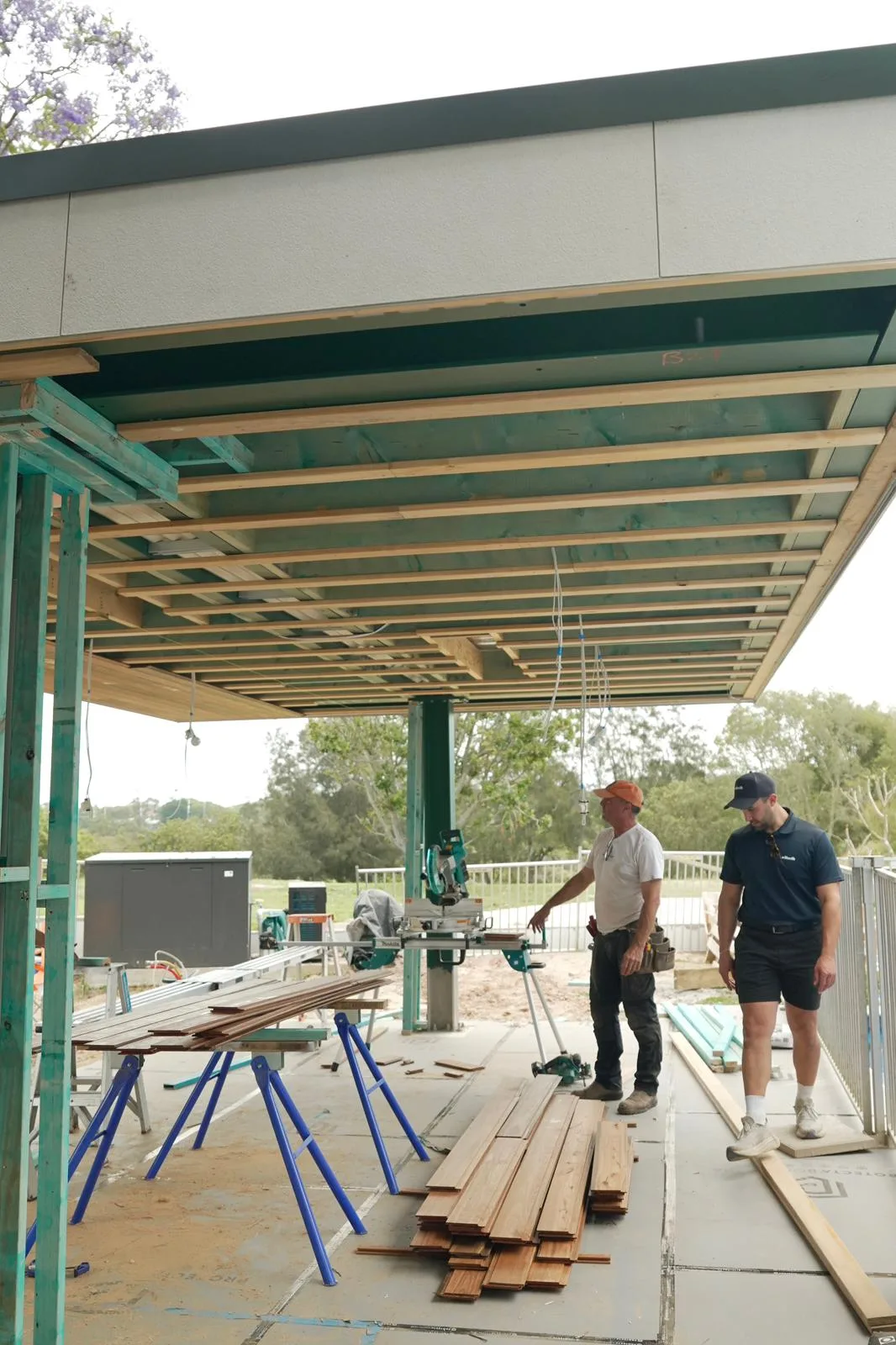 Spotted gum boards stacked on site ready for installation to the cabana ceiling