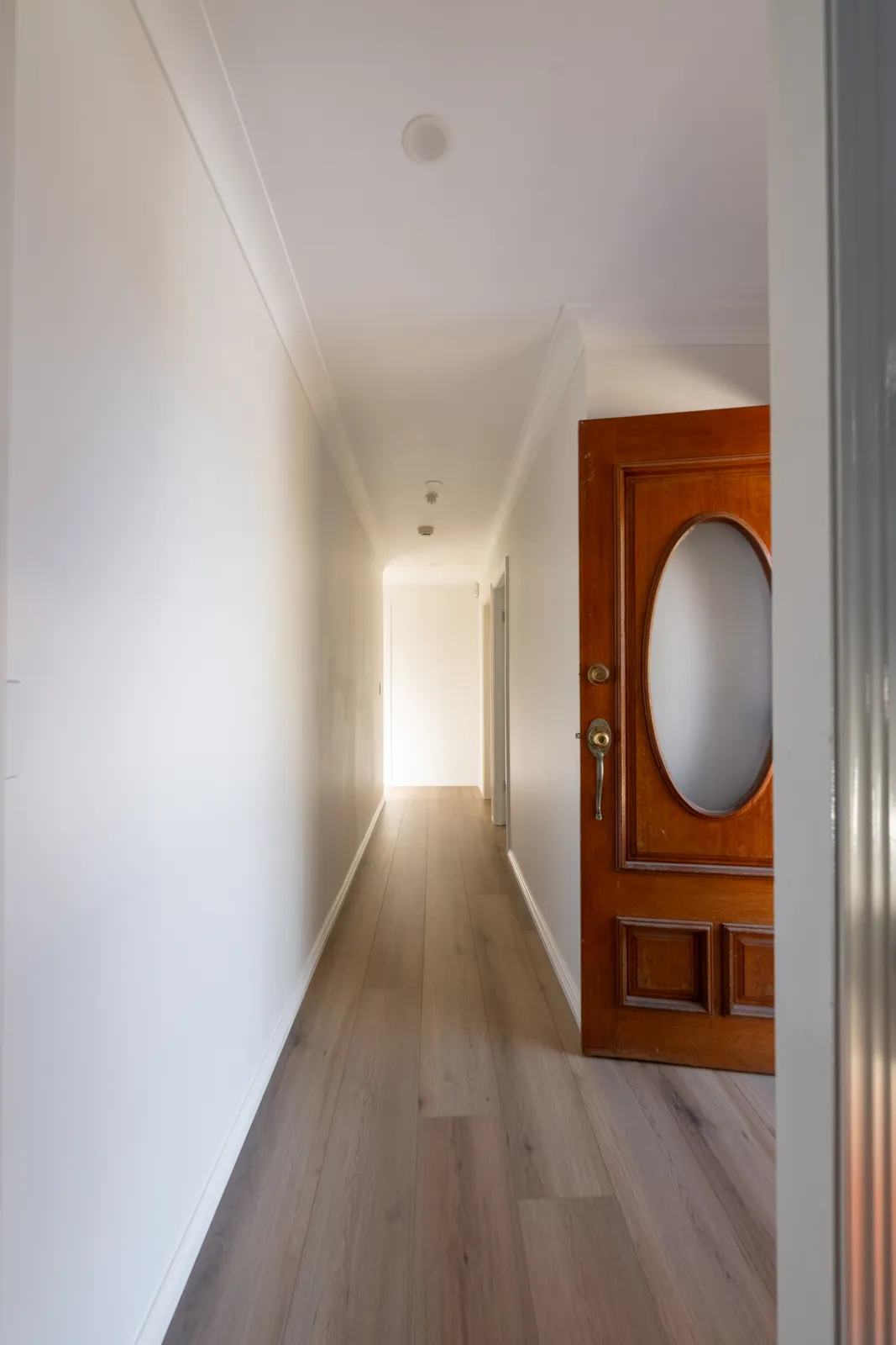 Toongabbie hallway after renovation with new timber-look flooring