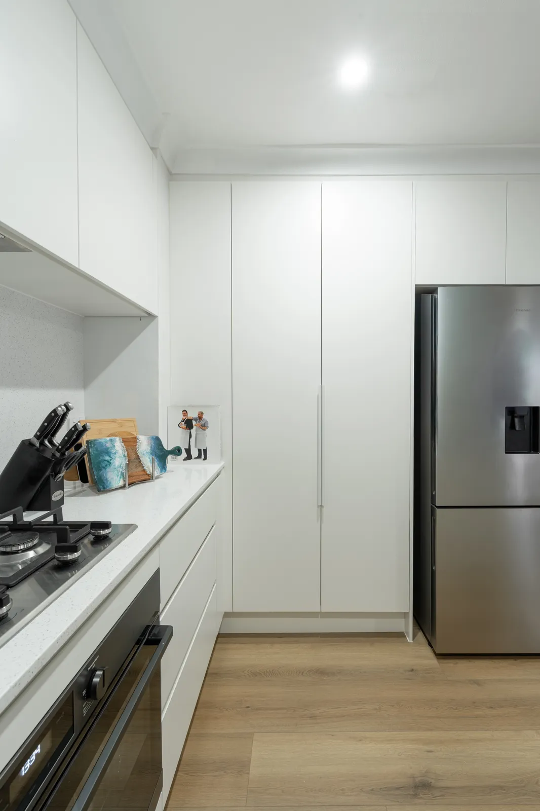 Toongabbie kitchen oven run with pot drawers, tall pantry and integrated fridge cabinet