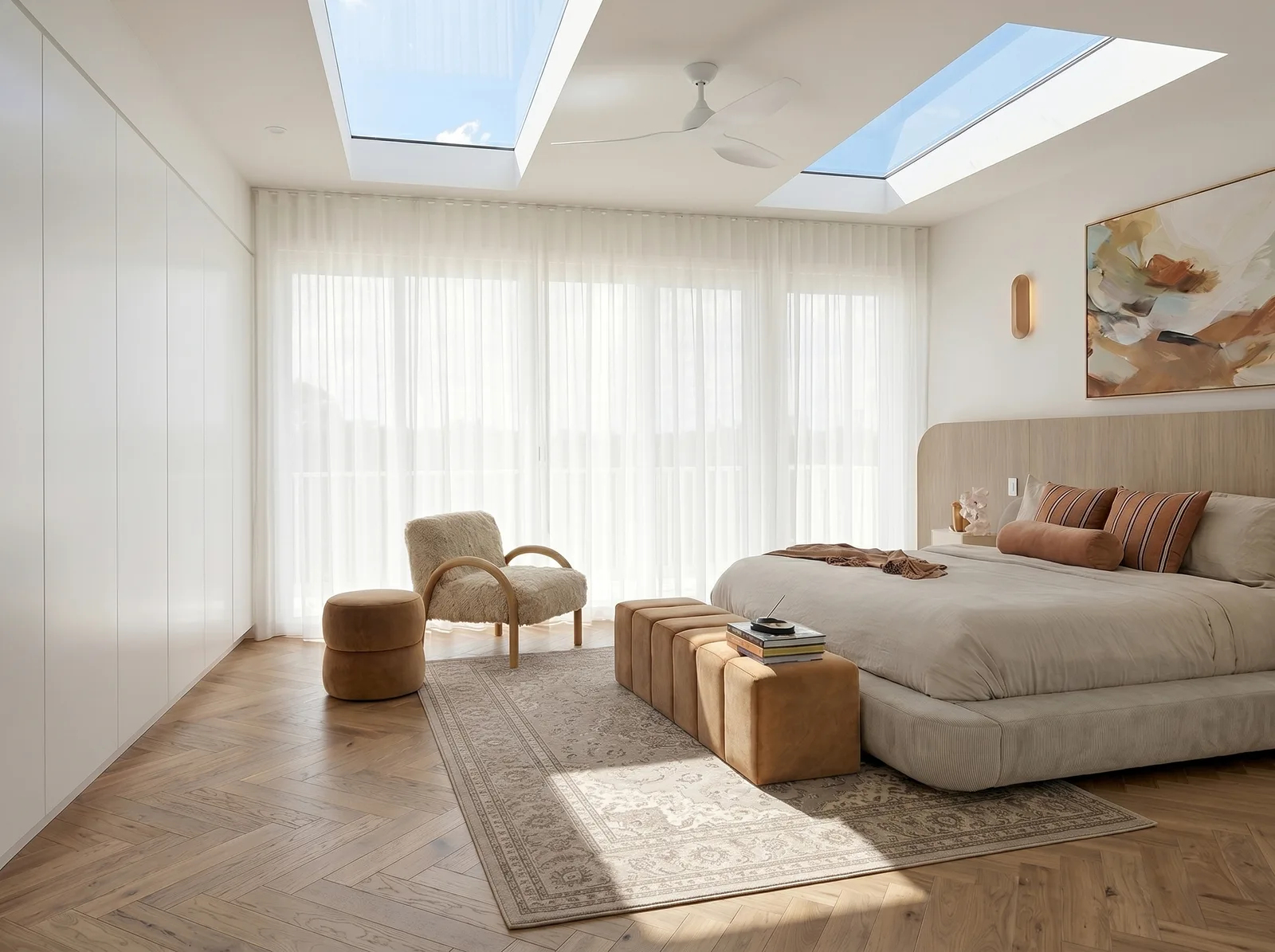 Light-filled Sydney bedroom interior renovation with skylights, sheer curtains and herringbone timber floor