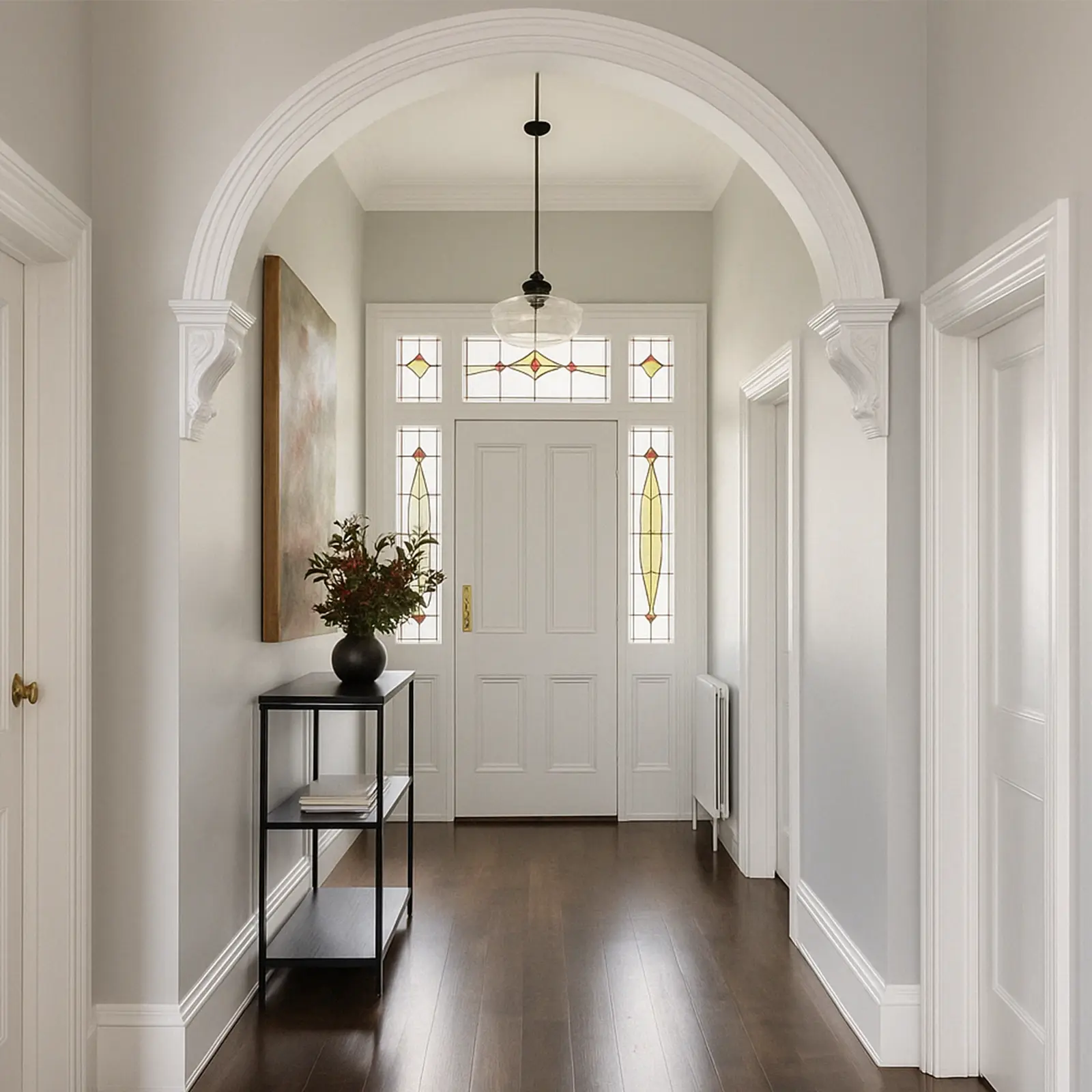 Bright modern hallway with white walls, timber flooring and pendant lighting